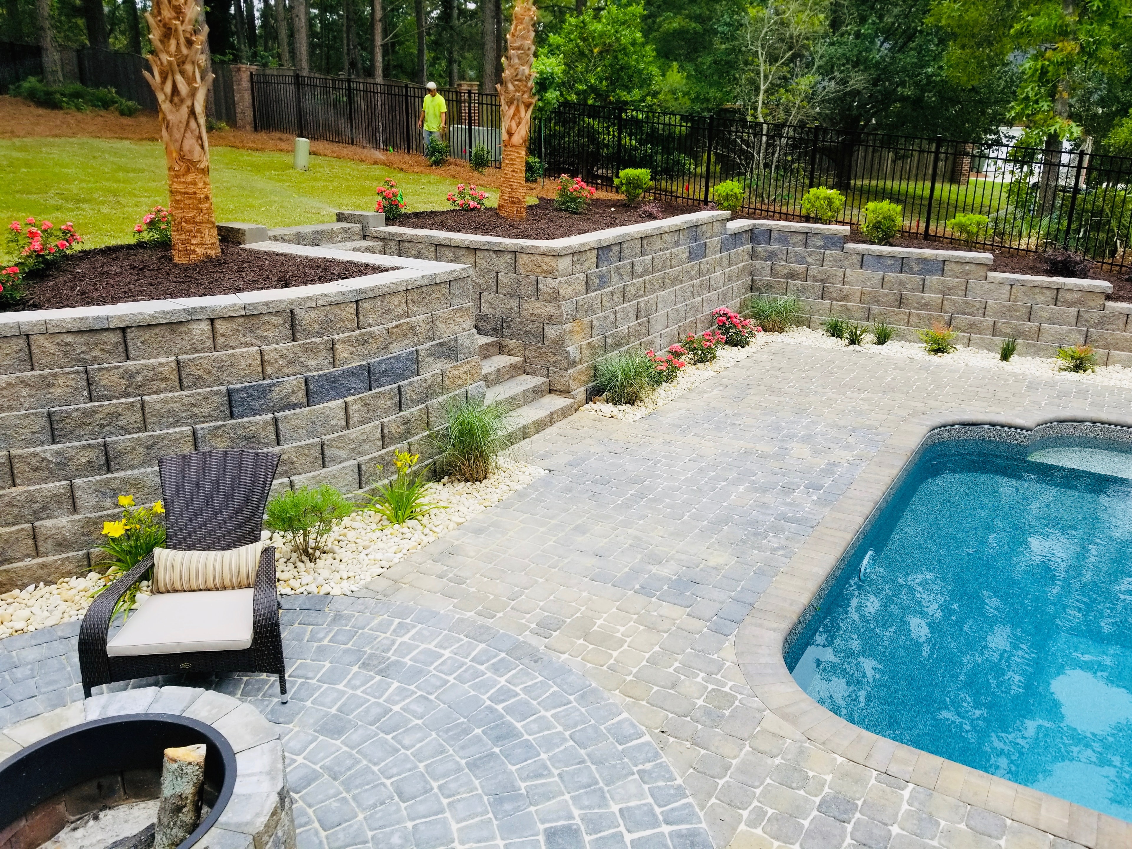 Backyard pool patio with retaining walls